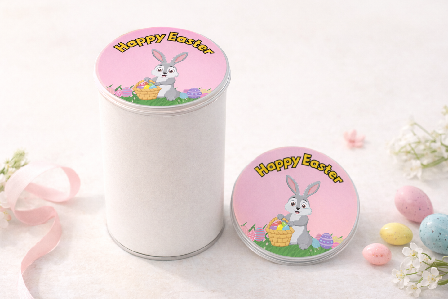 White cylindrical container with 'Happy Easter' lid featuring a bunny and basket design and button on a light background.